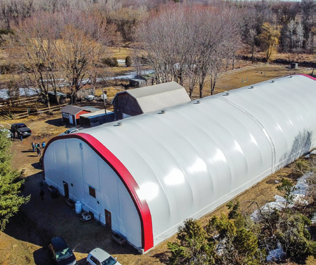 Completed round-profile fabric building installation in Ontario